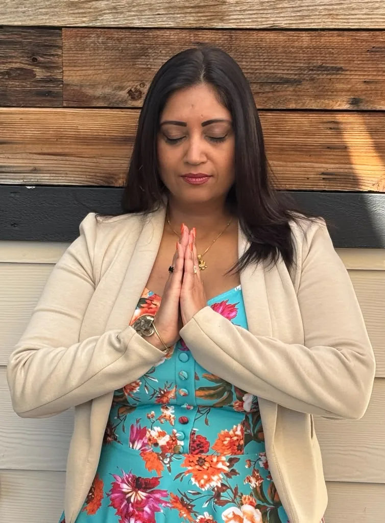 Rachana Wahab in namaste prayer pose